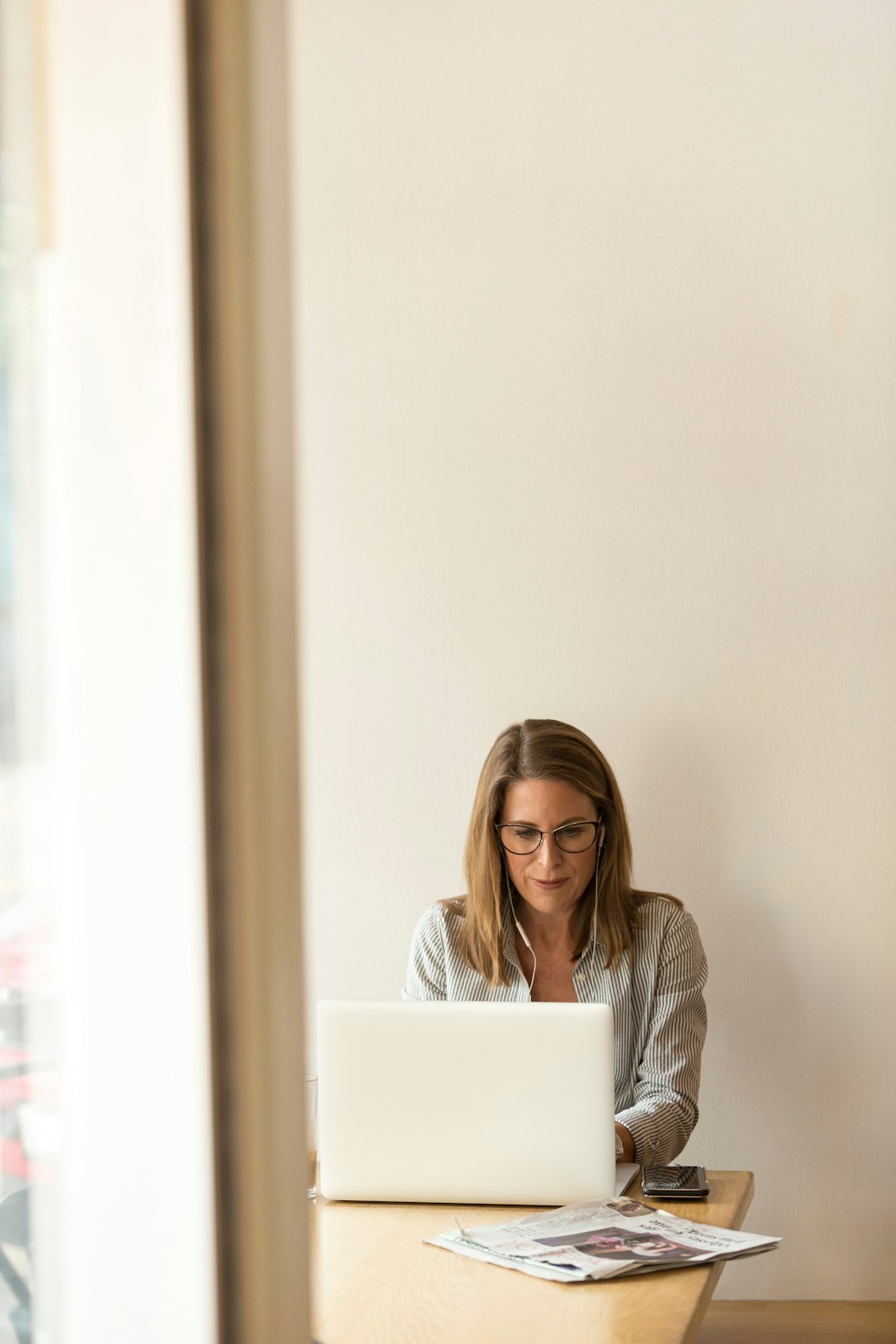 Employee using a laptop while reviewing HR information